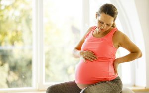 Беременная женщина и боль в пояснице